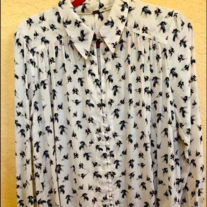 FreePeople button-front blouse with long sleeves.